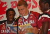 University of South Carolina football players read books to hundreds of children at Richland County Public Library in Columbia. The Pigskin Poets program, now in its 13th season, was held in the library auditorium, which was transformed into a stadium complete with banners, cheerleaders, and USC mascot Cocky.