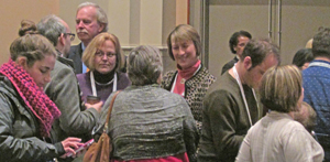 Attendees network with DPLA representatives at Midwinter. Photo by Stephen M. Brooks