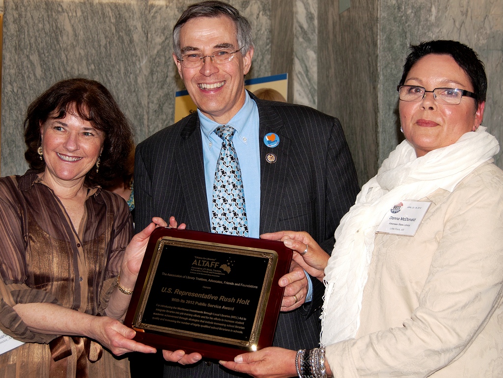 Rep. Rush Holt (D-New Jersey) receives ALA's Association of Library Trustees, Advocates, Friends and Foundations' (ALTAFF) Public Service Award from division Director Sally Gardner Reed (left) and ALTAFF President Donna McDonald.