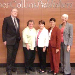 Virginia Stanley (second from left), director of library marketing at HarperCollins, greets ALA delegation members Bob Wolven, Maureen Sullivan, Molly Raphael, and Barbara Stripling.