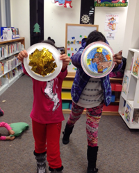 Girls at Alexandria (Va.) Library make shields of courage as part of the Girls of Courage program.